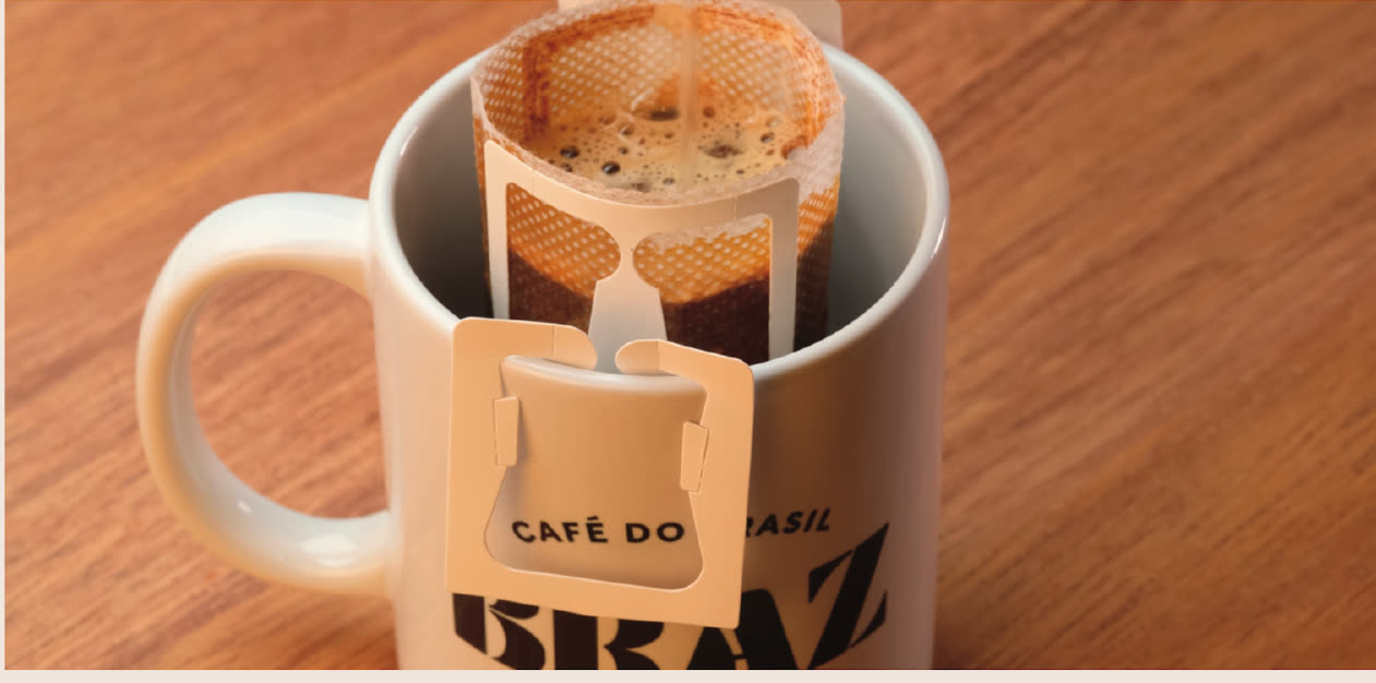 A Braz drip bag brewing in a Braz mug